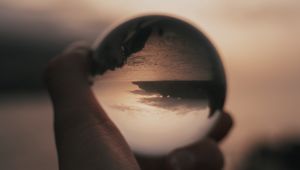 Preview wallpaper crystal ball, ball, hand, reflection, illusion