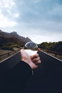 Preview wallpaper crystal ball, ball, hand, road, reflection