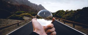 Preview wallpaper crystal ball, ball, hand, road, reflection