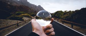 Preview wallpaper crystal ball, ball, hand, road, reflection