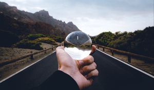 Preview wallpaper crystal ball, ball, hand, road, reflection