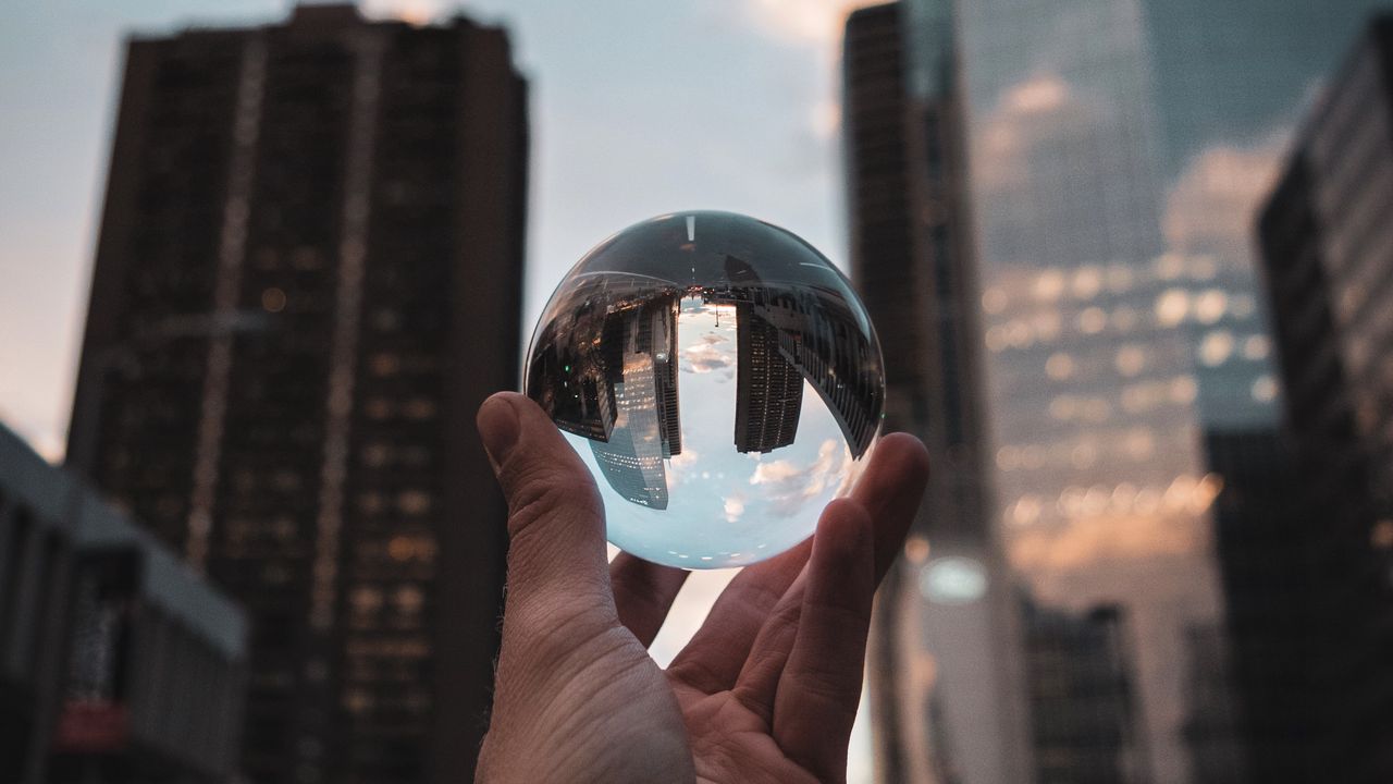 Wallpaper crystal ball, ball, hand, reflection, city, buildings