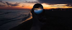 Preview wallpaper crystal ball, ball, hand, sunset, dusk, dark