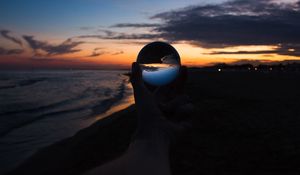 Preview wallpaper crystal ball, ball, hand, sunset, dusk, dark