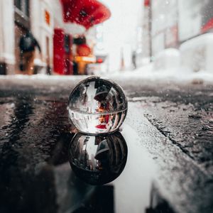 Preview wallpaper crystal ball, ball, puddle, snow, reflection