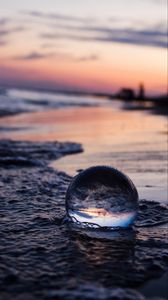 Preview wallpaper crystal ball, ball, reflection, beach, sea, sunset