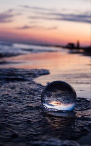 Preview wallpaper crystal ball, ball, reflection, beach, sea, sunset