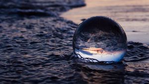 Preview wallpaper crystal ball, ball, reflection, beach, sea, sunset