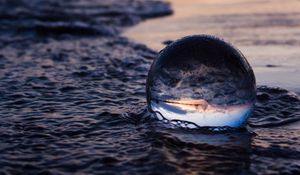 Preview wallpaper crystal ball, ball, reflection, beach, sea, sunset