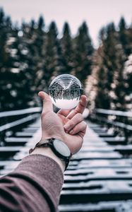 Preview wallpaper crystal ball, ball, sphere, hand, reflection