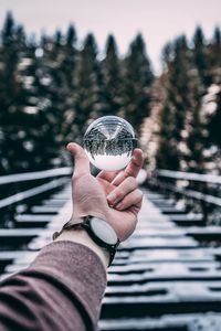 Preview wallpaper crystal ball, ball, sphere, hand, reflection