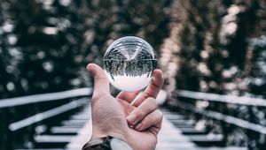 Preview wallpaper crystal ball, ball, sphere, hand, reflection