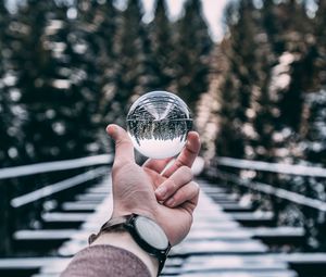 Preview wallpaper crystal ball, ball, sphere, hand, reflection