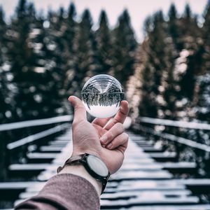 Preview wallpaper crystal ball, ball, sphere, hand, reflection