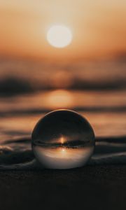 Preview wallpaper crystal ball, ball, sunset, beach, sea