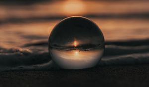 Preview wallpaper crystal ball, ball, sunset, beach, sea