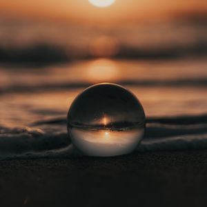 Preview wallpaper crystal ball, ball, sunset, beach, sea