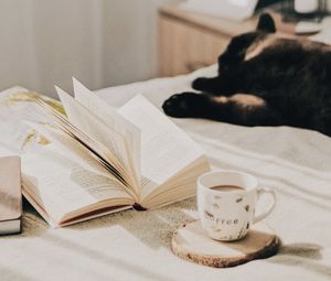 Preview wallpaper cup, coffee, book, pages, cat