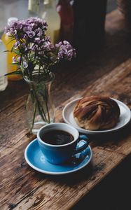 Preview wallpaper cup, coffee, pastries, bun, bouquet, flowers