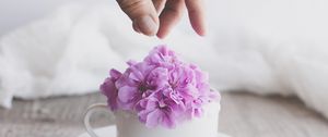 Preview wallpaper cup, flowers, hand, aesthetics