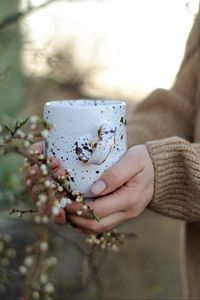 Preview wallpaper cup, flowers, hands, spring