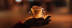 Preview wallpaper cup, garland, hands, glow, night