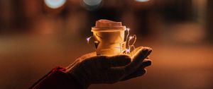 Preview wallpaper cup, garland, hands, glow, night