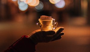 Preview wallpaper cup, garland, hands, glow, night