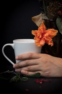 Preview wallpaper cup, hand, flowers, dark