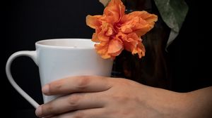 Preview wallpaper cup, hand, flowers, dark
