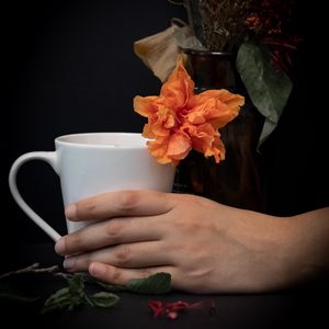 Preview wallpaper cup, hand, flowers, dark