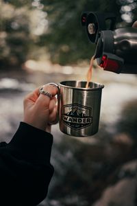 Preview wallpaper cup, hand, thermos, camping, focus