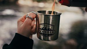 Preview wallpaper cup, hand, thermos, camping, focus