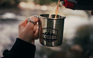 Preview wallpaper cup, hand, thermos, camping, focus