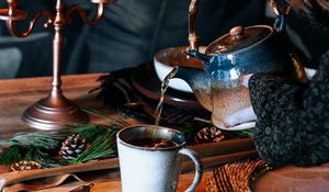 Preview wallpaper cup, kettle, tea, hands, candles