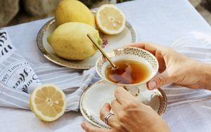 Preview wallpaper cup, lemon, hands, rings, tablecloth