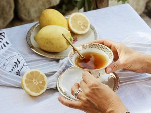 Preview wallpaper cup, lemon, hands, rings, tablecloth