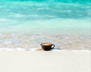 Preview wallpaper cup, ocean, sand, coast, minimalism