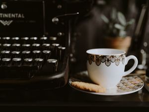 Preview wallpaper cup, saucer, cookies, typewriter, keys