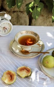 Preview wallpaper cup, tea, figs, alarm clock, tablecloth