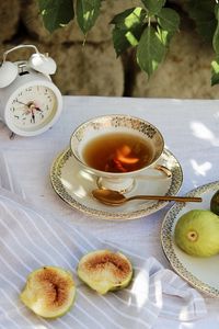 Preview wallpaper cup, tea, figs, alarm clock, tablecloth