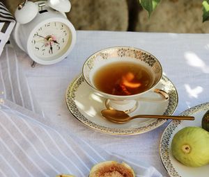 Preview wallpaper cup, tea, figs, alarm clock, tablecloth