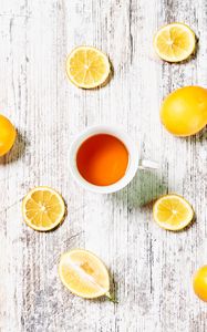 Preview wallpaper cup, tea, lemons, slices, citrus