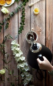 Preview wallpaper cup, teapot, tea, hand, flowers