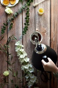 Preview wallpaper cup, teapot, tea, hand, flowers