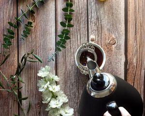 Preview wallpaper cup, teapot, tea, hand, flowers