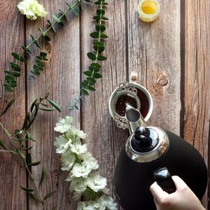 Preview wallpaper cup, teapot, tea, hand, flowers