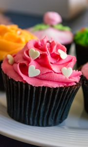 Preview wallpaper cupcake, cake, cream, sprinkling, hearts, pink, dessert