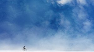Preview wallpaper cyclist, minimalism, sky, art, clouds