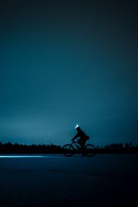 Preview wallpaper cyclist, night, bike, silhouette, light, horizon